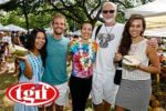 photo of smiling VegFest Oahu participants with TGIF logo label