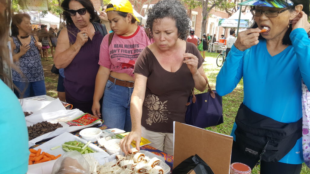 crowd eating bite-sized vegan samples at vegfest oahu