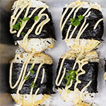 sushi burgers - four nori-wrapped sushi burgers drizzled with dressing